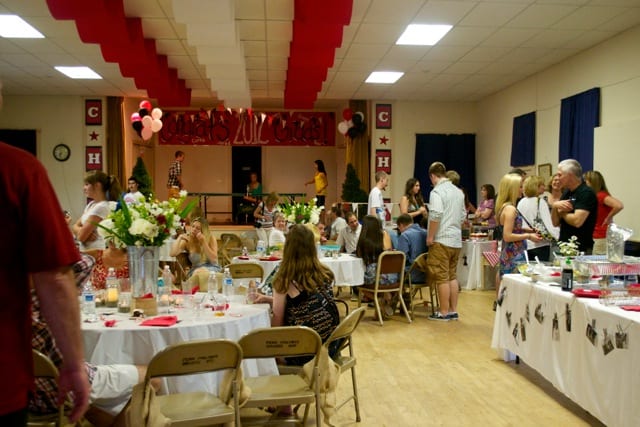 decorated graduation party hall filled with guests